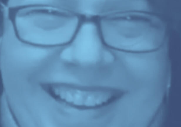 Liz Allen smiling on a zoom call